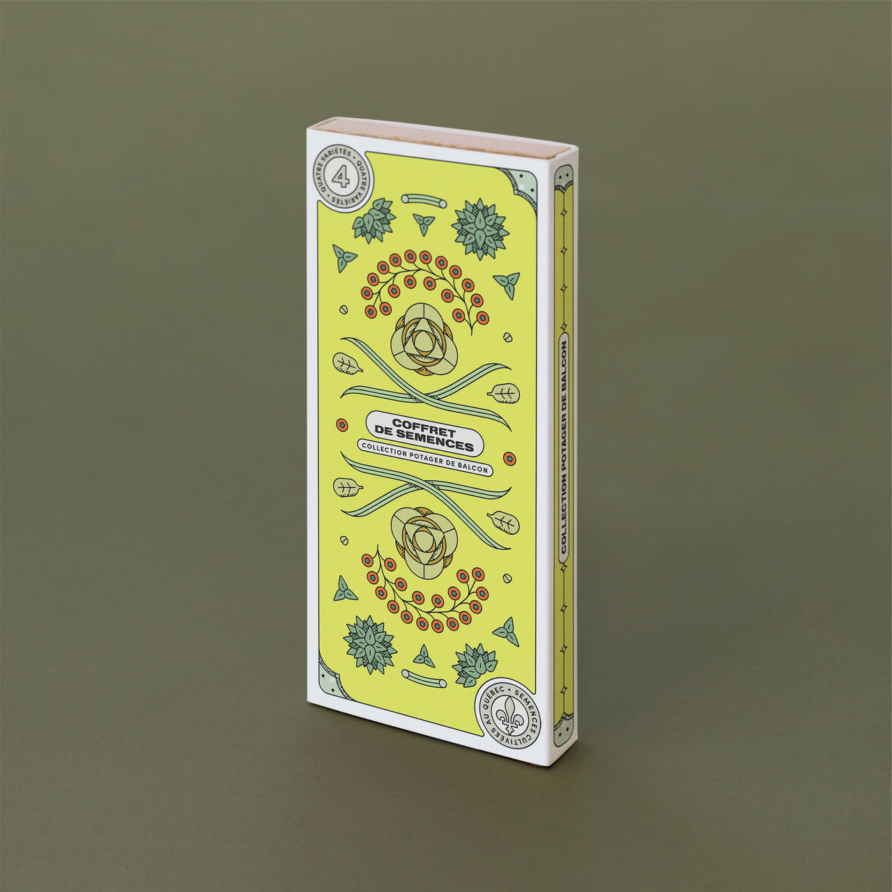 Boite rectangulaire jaune avec des dessins des variétés de semences qu'elle contient. On peut lire : « Coffret de semences : Potager de balcon ».