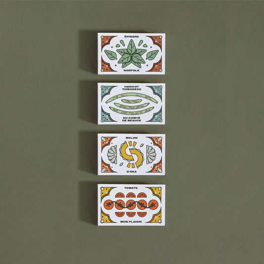 Quatre (4) petites boites, chacune illustrée avec la variété de semences qu'elle contient.