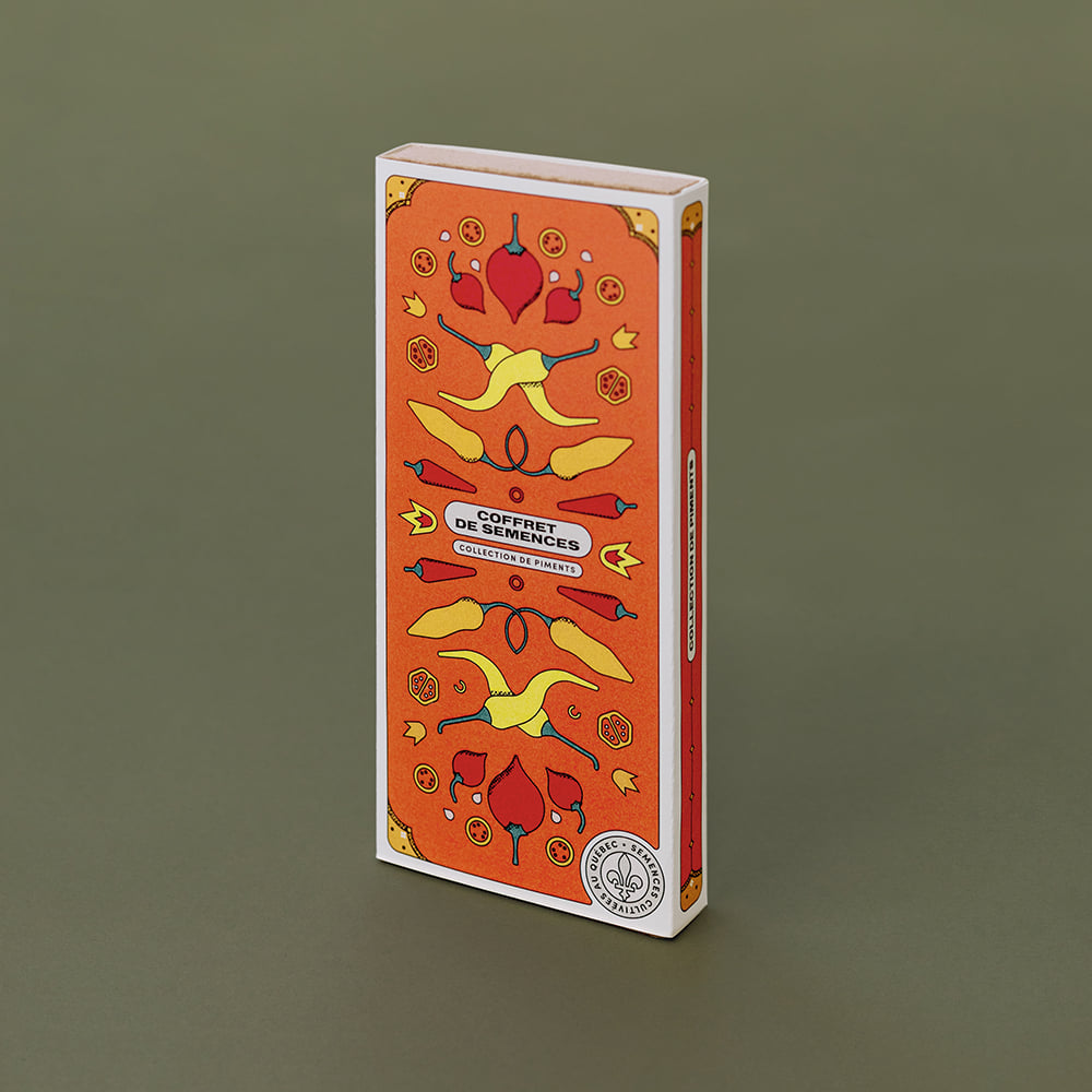 Boîte orange «avec des dessins de piments jaunes et rouges sur lequel on lit « Coffret de semences : Collection de piments »