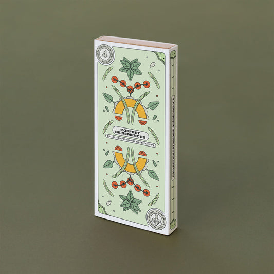 Boite rectangulaire verte pâle avec des dessins des variétés de semences qu'elle contient. On peut lire : « Coffret de semences : Collection patrimoine québécois #2 ».