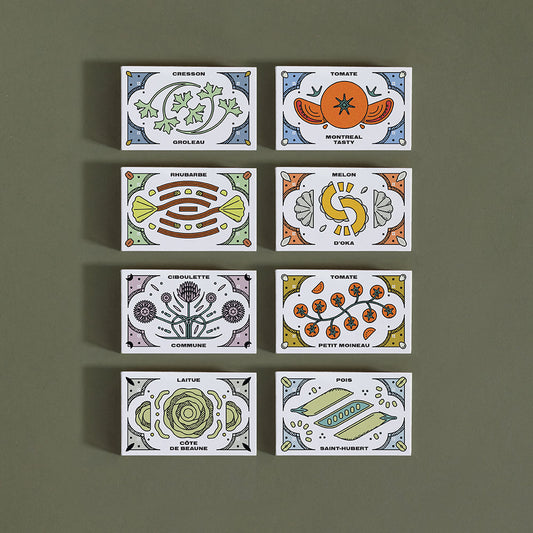 Huit (8) petites boîtes rectangulaires, cahcune représentant un légumes ou une fleur différente