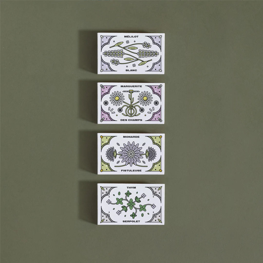 Qautre (4) petites boites, chacune illustrée avec la variété de plante qu'elle renferme.